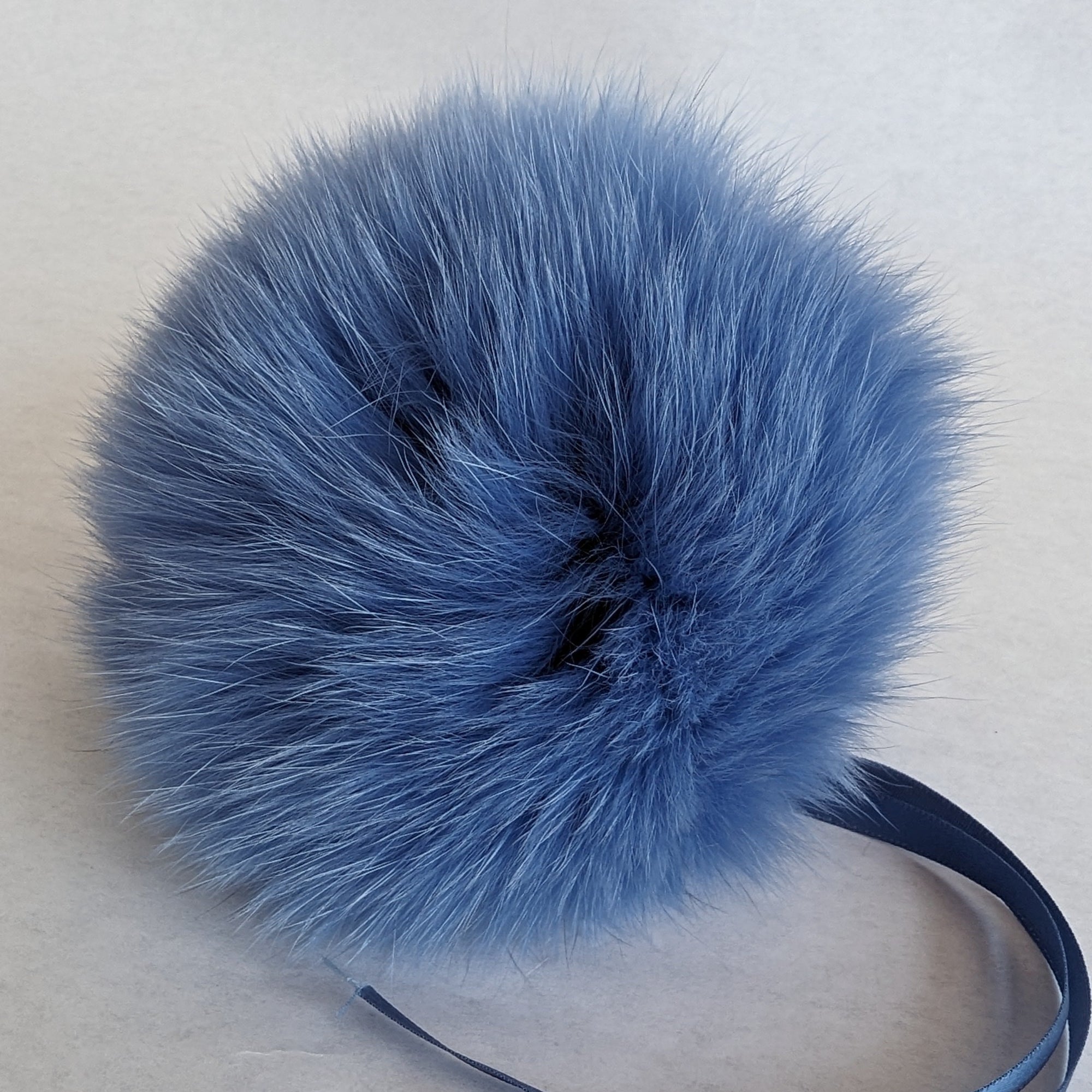 fox fur pom blue jay