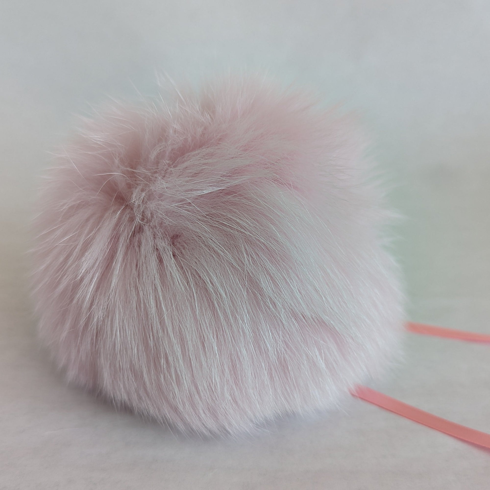 fox fur pom pink